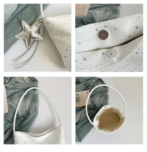 White star print shoulder bag detail view, minimalist faux leather underarm bag with star pendant.