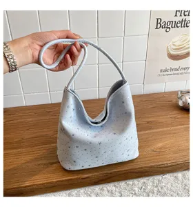 Detailed view of a light blue star print shoulder bag, chic underarm bag for daily use.