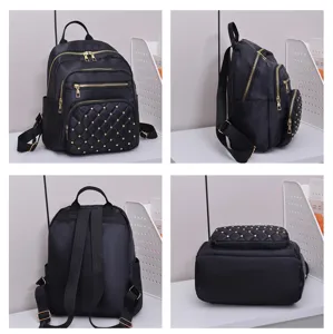 Detail view of black quilted nylon backpack with gold studs, multi-pocket design, back and side.