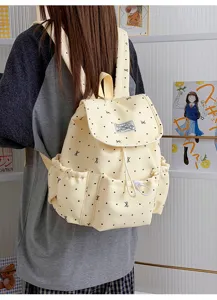 Süßer gepunkteter Canvas Rucksack für Mädchen, lässiger College Style Tagesrucksack.