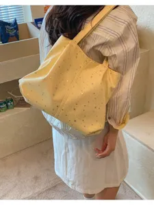 Yellow star pleated underarm tote bag, stylish shoulder bag for women daily commuting.