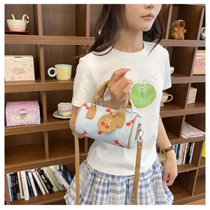 Cute denim cherry print barrel shoulder bag for women, stylish casual crossbody handbag.