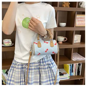 Cute denim cherry print cylindrical handbag, trendy fashion single shoulder crossbody bag for women.