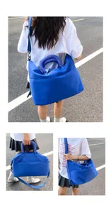 Detailed view of the large capacity blue yoga gym travel bag, showing shoulder and handbag carry styles.
