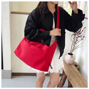 Large capacity red shoulder crossbody bag made of thick canvas for daily fitness and travel use.