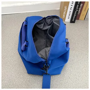 Detailed view of the blue yoga duffel bag interior, featuring spacious storage and compartments.
