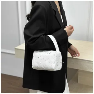 White quilted handbag with cute star print, portable fashion wrist bag for women daily commute.