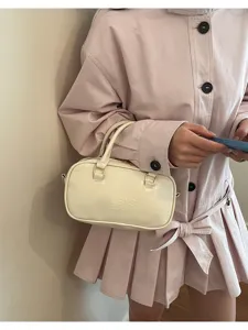 White leather Boston handbag for women, casual bowling shoulder bag with top handle.