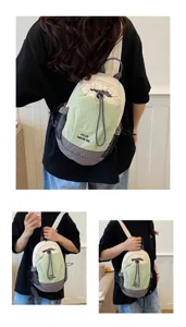Detail view of the multi-functional dual-use small canvas backpack with stylish drawstring.