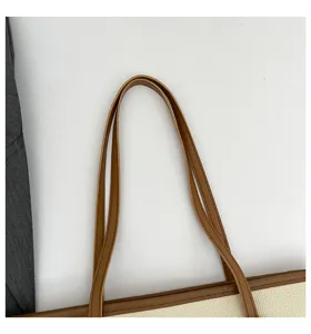 Detail view of fashion casual large capacity shoulder tote bag with brown handles.