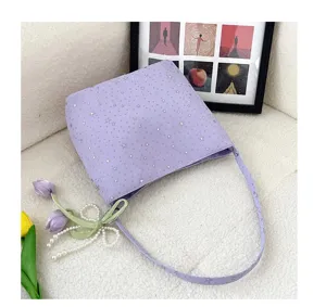 Chic star print purple shoulder bag, stylish underarm bag detail shot with cute pendant.