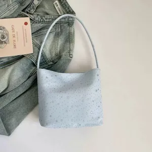 Minimalist light blue shoulder bag with silver stars, stylish underarm bag for daily wear.