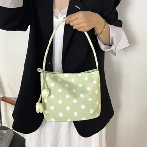 Chic light green polka dot shoulder bag with cute tulip charm. Versatile daily underarm bag.