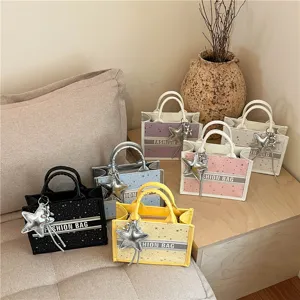 Canvas mini tote bag with star print, stylish top handle handbag and cute star pendant charm.
