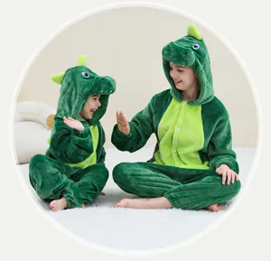 Kids green dinosaur flannel onesie pajamas, cute animal costume for children and holiday performance wear.