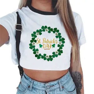 White crop top detail featuring a festive green clover wreath and St. Patrick's Day graphic.