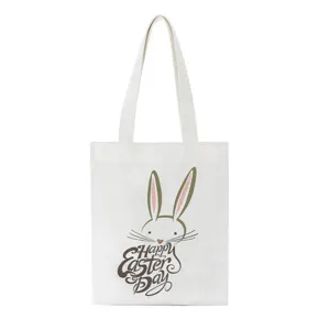 Witte canvas shopper tas met schattige paashaas print en Happy Easter tekst detail erop.