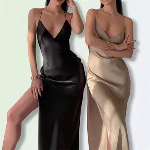 Detailed view of elegant satin slip dress with V-neck, thin straps and high side slit features.