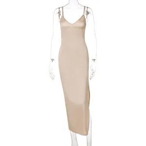 Champagne V-neck slip dress, elegant midi length with side slit and thin straps detail.