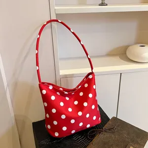 Red polka dot shoulder bag for women, stylish underarm bag for daily commuting and casual outing.