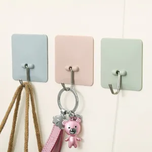 Versatile adhesive wall hooks set, waterproof sticky hangers for kitchen, bathroom and home use.