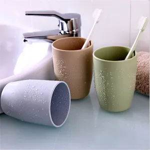 Minimalist solid color plastic mouthwash cup and toothbrush holder set for bathroom
