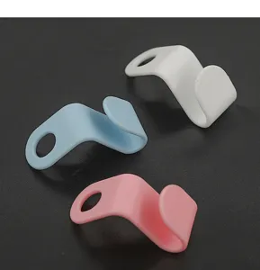 Close-up view of colorful clothes hanger connecting hooks designed for space-saving wardrobe storage.