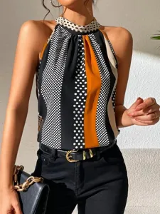 Stylish women's printed high neck halter top featuring chic stripe and polka dot colorblock.