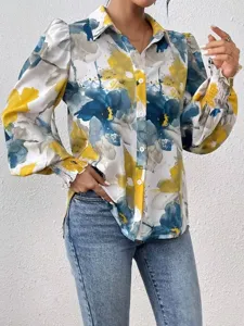 Abstract print long sleeve blouse detail, featuring turn-down collar and chic puff sleeves.