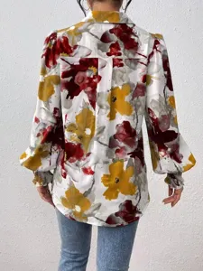 Detailed back view of the floral print blouse featuring chic puff sleeves and a classic lapel.