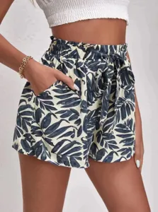 Detailed view of women high waist tropical leaf print casual shorts with bow belt and pockets.