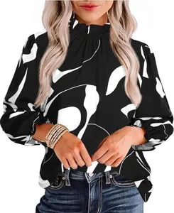 Close-up detail of the elegant black and white abstract print long sleeve blouse fabric.