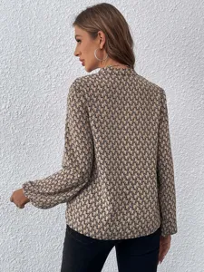 Elegant long sleeve geometric print blouse with pleated collar and chic lantern sleeves.