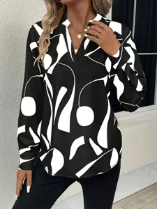 Close-up detail of the stylish black and white abstract print V-neck long sleeve blouse.
