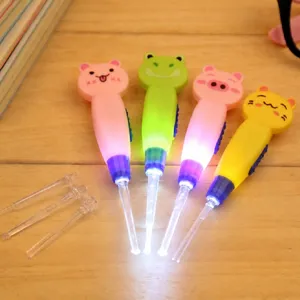 LED cartoon animal luminous ear spoon set with clear interchangeable replacement heads.