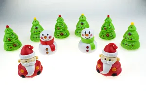 Christmas pull-back toy detail shot, cute snowman and tree shapes, holiday gift design.
