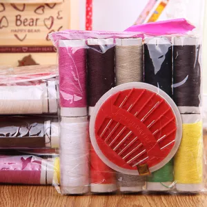 Portable sewing kit with colorful thread spools and needle case, ideal for home and travel use.