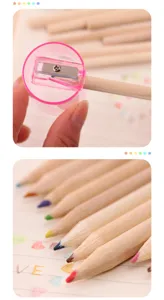 Wooden colored pencils detail showing pencil sharpener cap and fine tips for drawing.