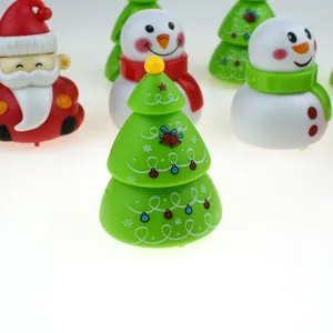 Close-up detail of cute Christmas tree wind-up toy, festive holiday toy gift for kids.