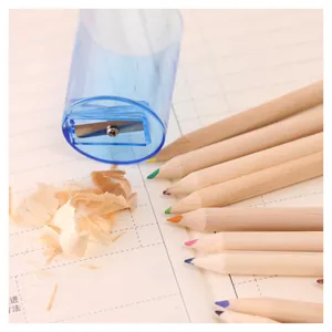 Transparent plastic pencil sharpener set with natural wood colored pencils for student art.