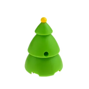Close-up detail of the green Christmas tree shaped pull-back toy car with a cute yellow top.