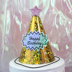 Detailed shot of shiny gold holographic birthday party hat with pink glitter star and label.