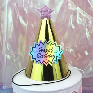 Gold birthday party hat with pink glitter star and Happy Birthday label for kids.
