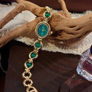 Elegante orologio al quarzo con quadrante verde ovale e cinturino a catena alla moda donna.