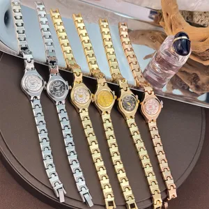 Compact thin strap quartz watch with minimalist small dial and unique link bracelet design.
