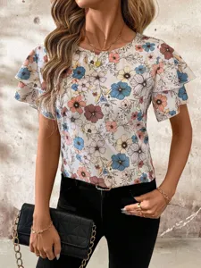 Detailed shot of women's floral print blouse featuring double layer flutter short sleeves.