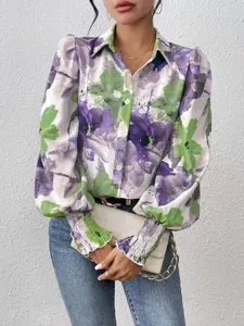 Close up view of women's floral print long sleeve button blouse with puff smocked cuffs