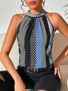 Detailed close-up shot of fashionable women halter neck sleeveless top featuring chic polka dot print.