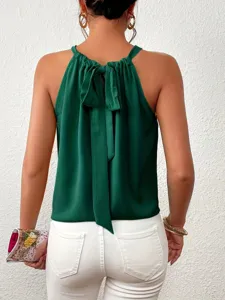 Detailed back view of a stylish dark green halter top with elegant bow tie for women.