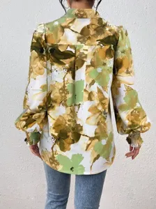 Detailed back view of the abstract floral print long sleeve blouse with smocked cuffs.